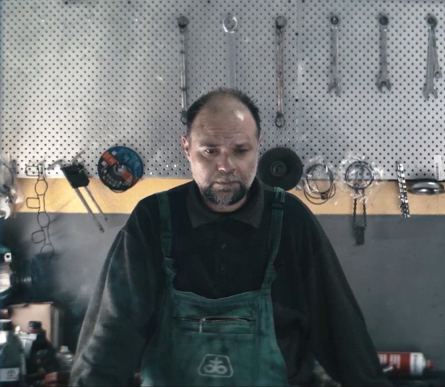 A character at work in a still from Table of Silence